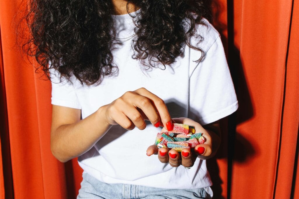 Bits Elderberry Wellness Review 2 Person-in-White-Shirt-Holding-Gummies