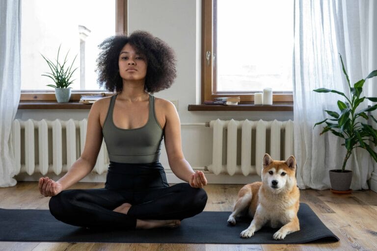 12 Steps of Self-Care: Unlocking the Power of Positivity 1 a-black-woamn-doing-exercise-with-a-dog-sitting-with-her-
