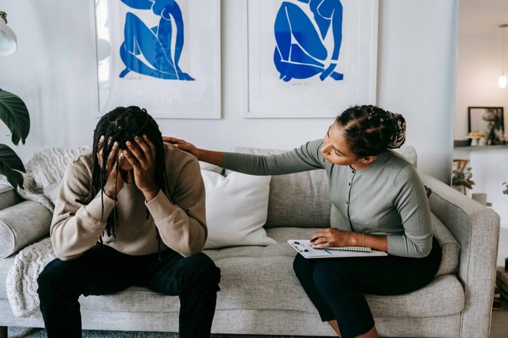 How Fast Does Ketamine Work for Anxiety and Its Benefits 1 Black-woman-consoling-anonymous-unhappy-boyfriend-on-sofa-at-home