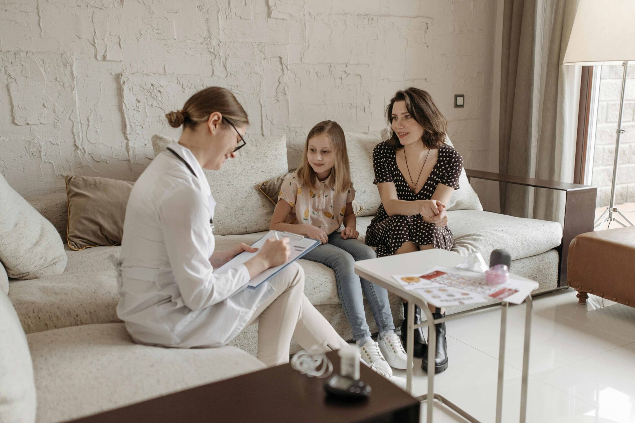 What Is Developmental Therapy? Types & Benefits 9 photo-of-a-doctor-in-a-consultation-with-a-mother-and-her-daughter