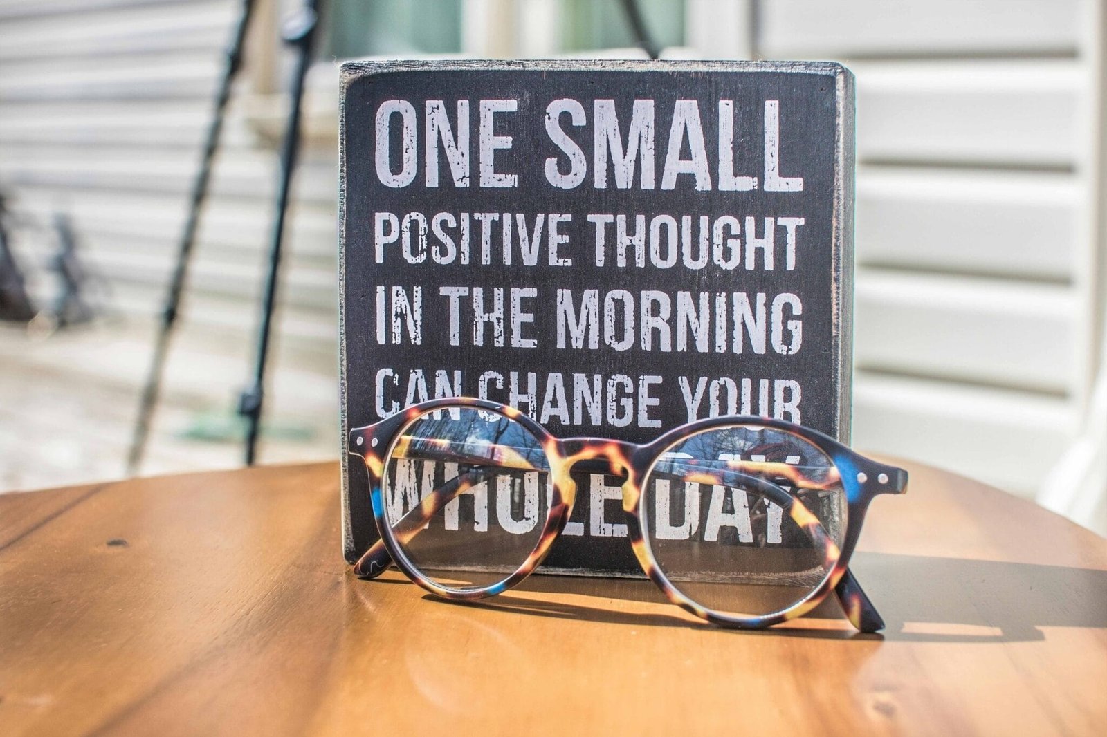 Inspiring Wellness Wednesday Quotes to Boost Your Week 1 photo-of-a-sign-and-eyeglasses-on-table