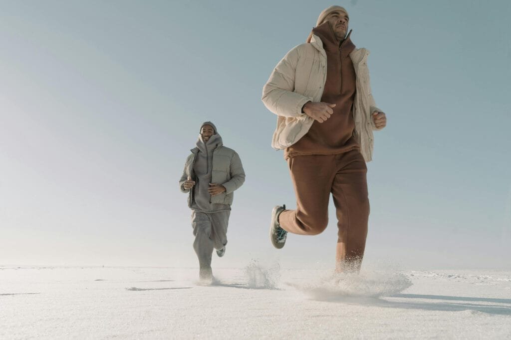 Ultimate Guide to Wellness Pods: Benefits, Types & Uses 1 photo-of-two-mans-wearing-puffer-jackets-running-on-thick-snow