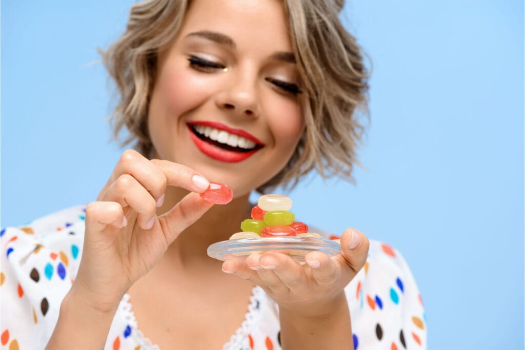Erth Wellness Reviews: Are They Worth the Hype? 1 girl-in-white-dress-eating-gummy-