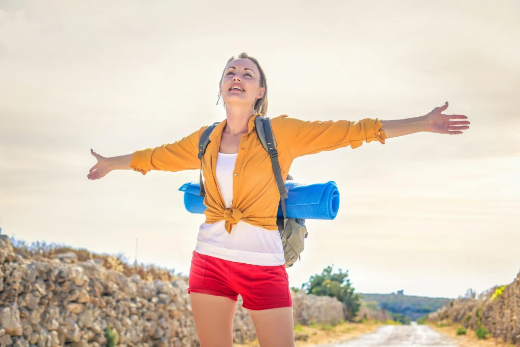 What is Advanced Wellness Insurance: Health Guide 6 photo-of-a-woman-feeling-free-after-take-insurance-in-yellow-long-sleeve-standing-under-the-sunlight-