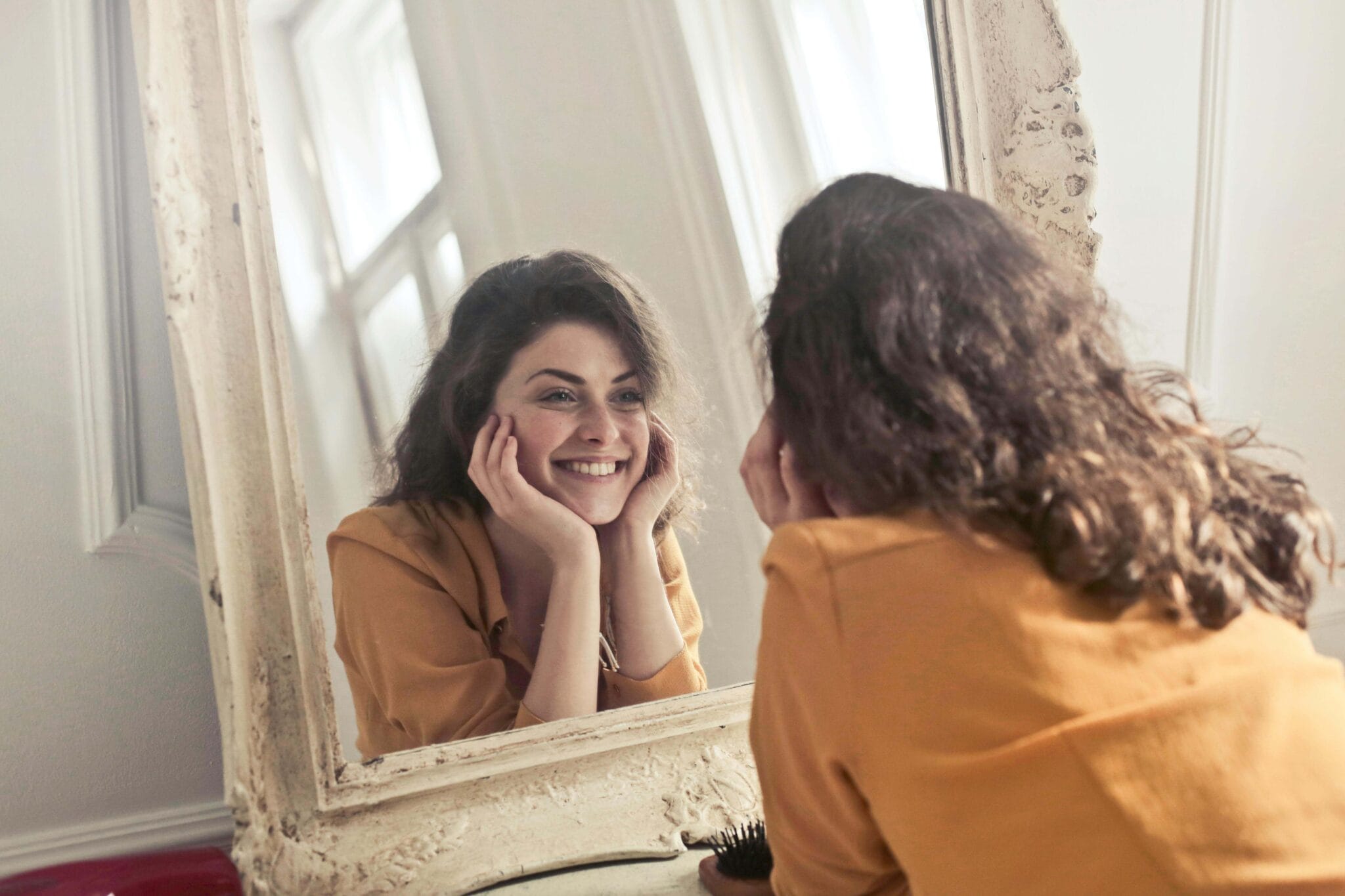 The Complete Guide to Happy Health and Wellness 5 photo-of-a-woman-looking-at-the-mirror