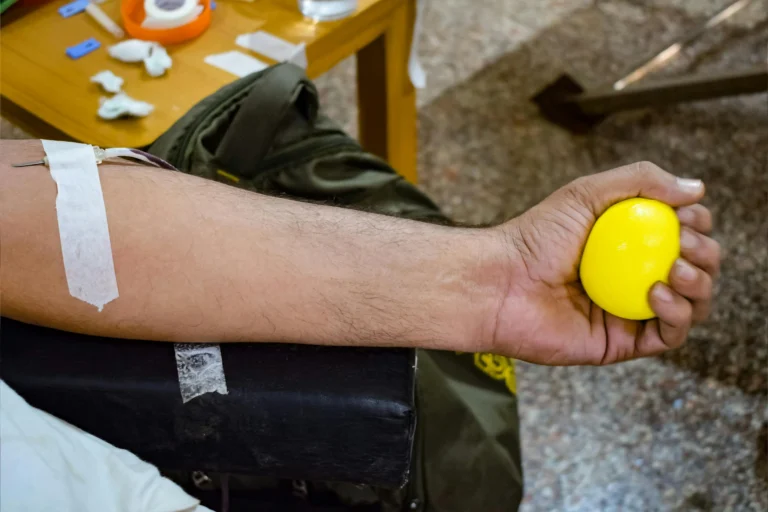 How Long Does IV Therapy Take? What to Expect 1 photo-of-close-up-of-holding-a-yellow-ball-while-donating-blood-