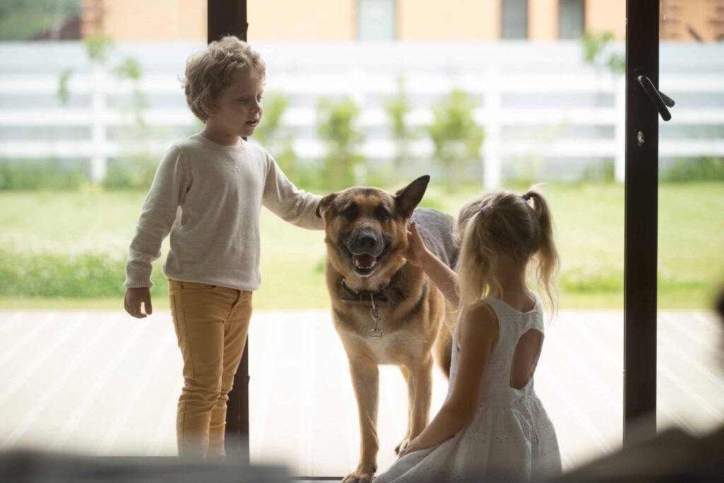 children-boy-girl-playing-with-dog-coming-inside-house